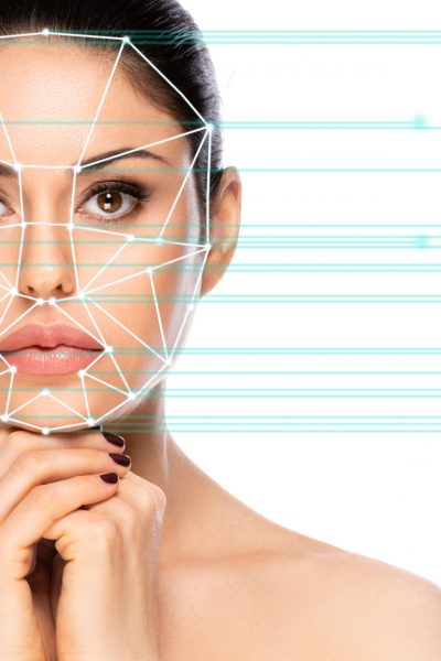 Biometric authentication concept. Facial recognition system of beautiful woman on white background